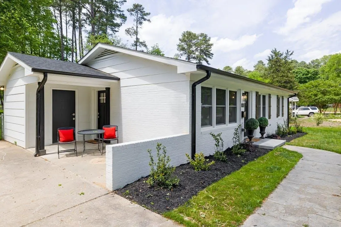 Modern white granny flat in Australia with a private garden path