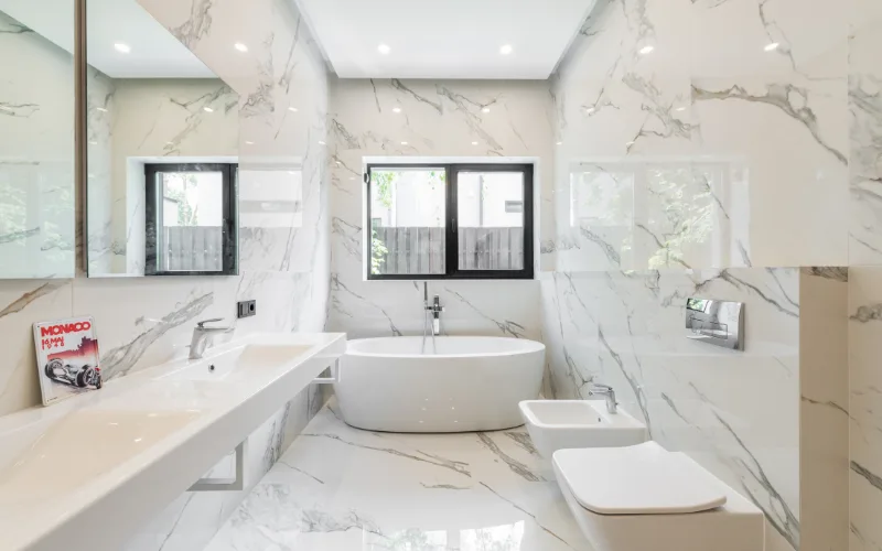 Granny flat bathroom tile ideas showing bold patterned floor and wall tiles