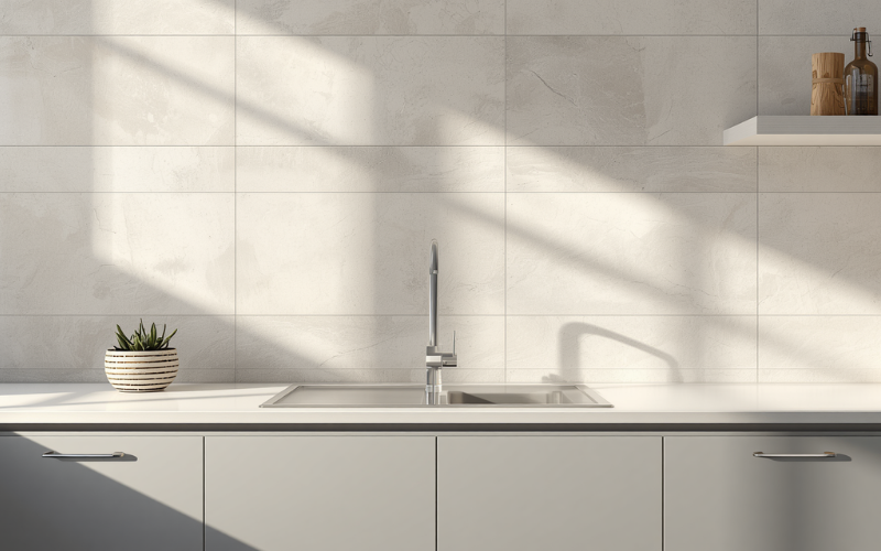 Large format porcelain slab splashback in a premium granny flat kitchen
